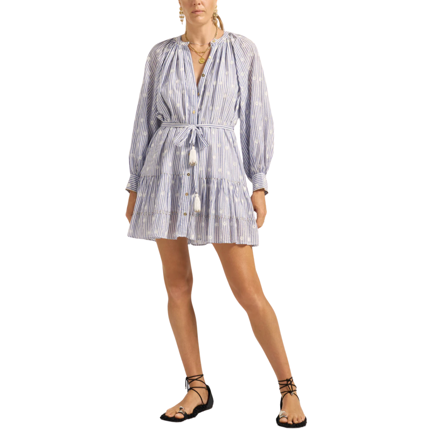 Woman wearing a blue and white striped dress on a white background