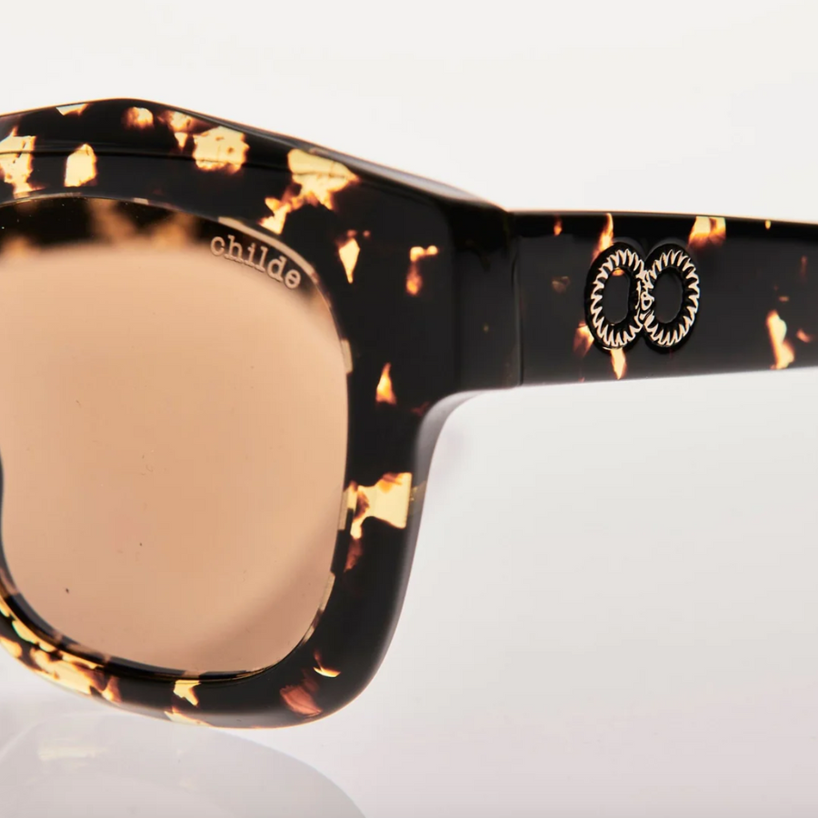 CHILDE Eco-Conscious Eyewear | VIVID Gloss Tort Sunglasses | Amber Bio Lens - Shop Online and In-Store at Nash + Banks